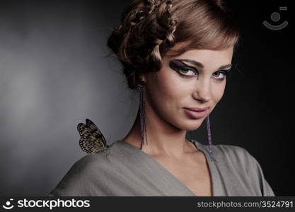 woman and butterfly on black