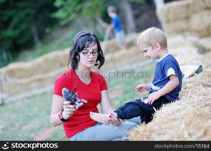 woman and child have fun outdoor at partk in nature