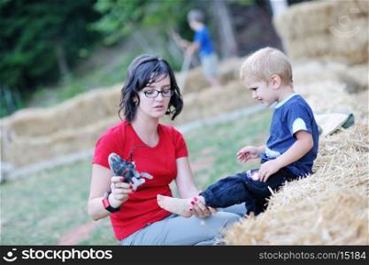 woman and child have fun outdoor at partk in nature