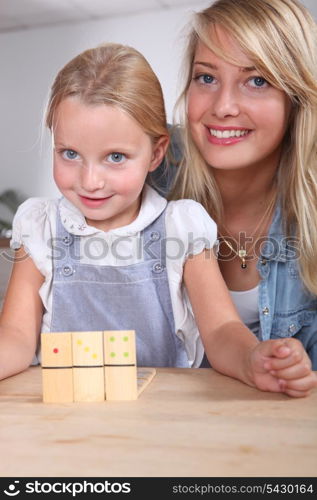 Woman and child playing dominoes