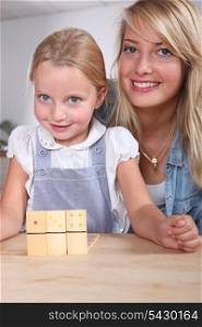 Woman and child playing dominoes