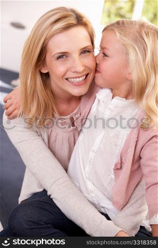 Woman and child pose in studio