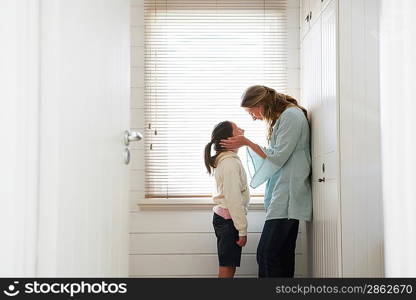 Woman and Daughter By Window