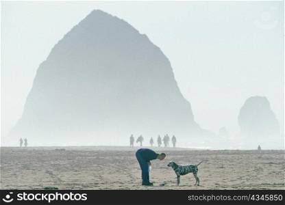 Woman and Dog at Cannon Beach Oregon
