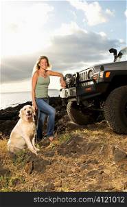 Woman and Dog by SUV at the Beach