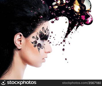 woman and face art with a lot of rhinestones on white background