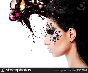 woman and face art with a lot of rhinestones on white background