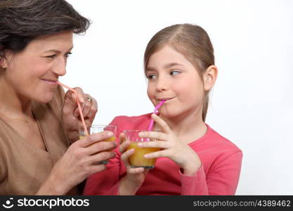 Woman and girl drinking