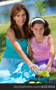 Woman and Girl, Mother & Daughter Eating Healthy Fruit Picnic