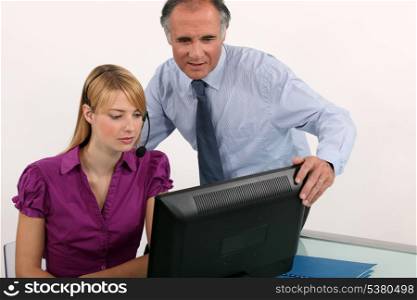 Woman and her boss at a computer