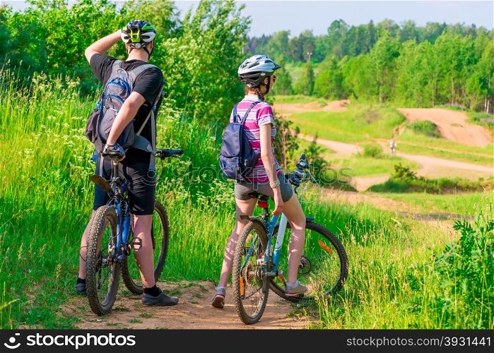 woman and her husband were on bikes on the mountain