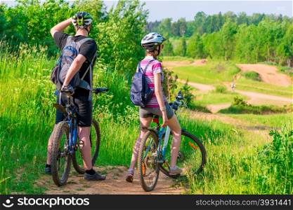 woman and her husband were on bikes on the mountain