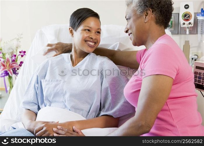 Woman And Her Mother Talking In Hospital