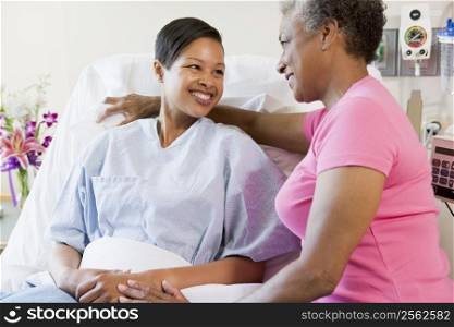 Woman And Her Mother Talking In Hospital