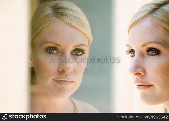 Woman and her reflection