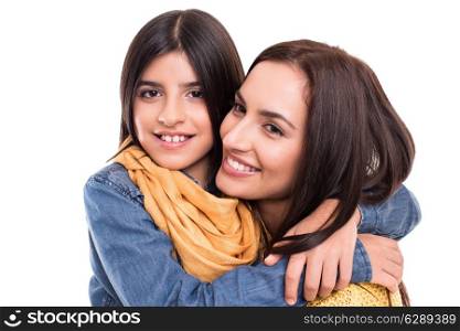 Woman and little girl hugging each other - Family concept