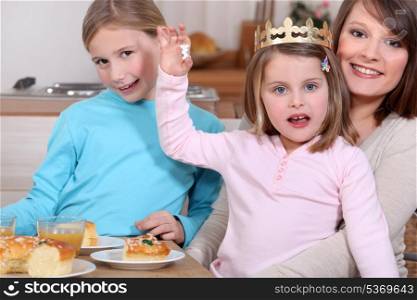 Woman and little girls celebrating Epiphany