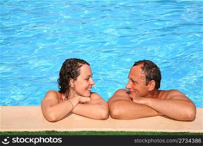 Woman and man at the pool board
