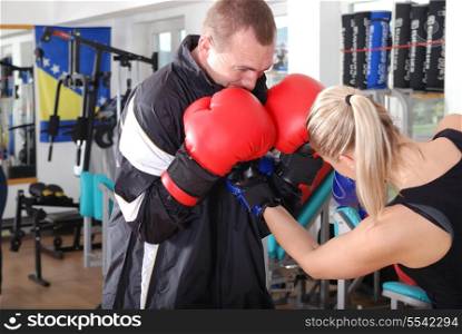 .woman and man box fighting