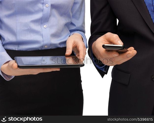 woman and man hands with smartphone and tablet pc