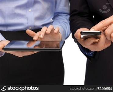 woman and man hands with smartphone and tablet pc