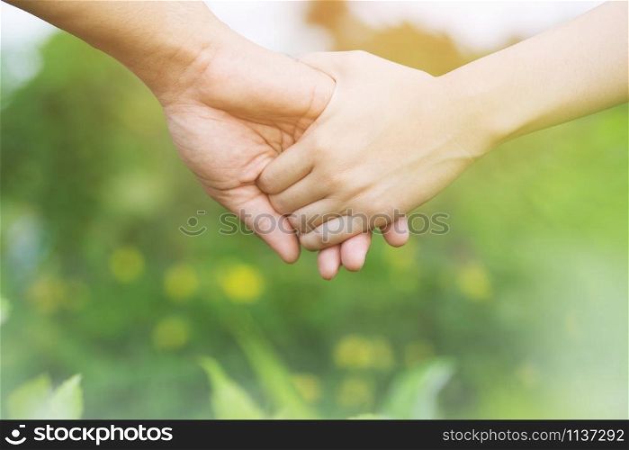 Woman and man holding Shake hands, Happy couple love in the garden. concept couple lover valentine day.