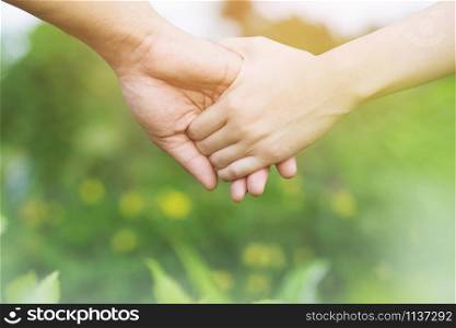 Woman and man holding Shake hands, Happy couple love in the garden. concept couple lover valentine day.