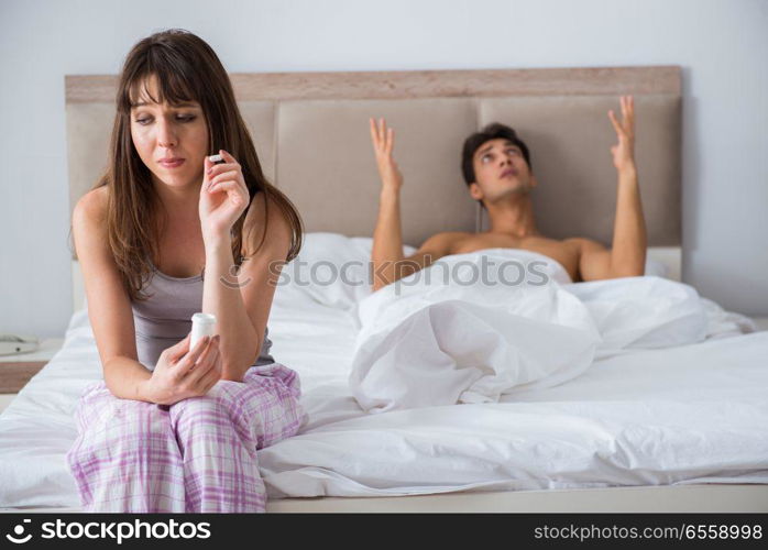 Woman and man in the bedroom