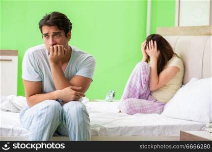 Woman and man in the bedroom after conflict