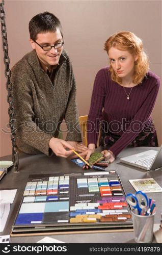 Woman and Man Looking at Colors