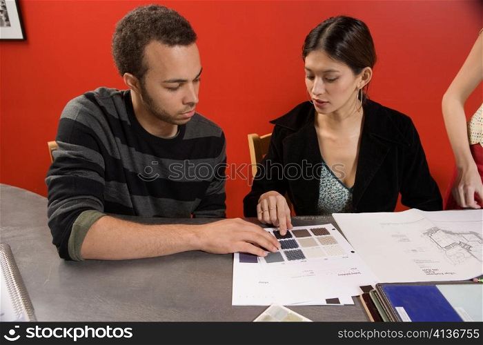 Woman and Man Looking at Neutral Colors