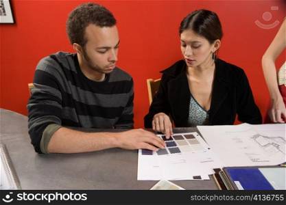 Woman and Man Looking at Neutral Colors
