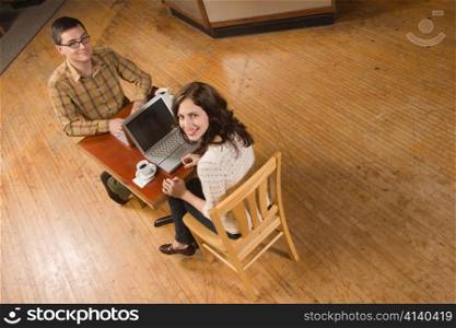 Woman and Man Posing with Computer Screen