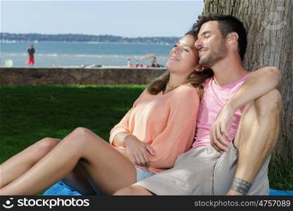 woman and man relaxing outdoors