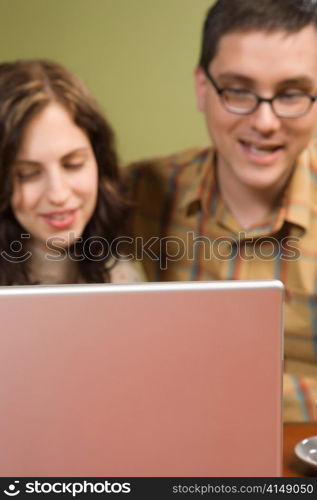 Woman and Man Staring at Laptop