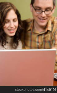 Woman and Man Staring at Laptop