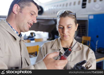 woman and man talking about tools