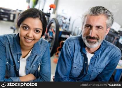 woman and man working in a bike store