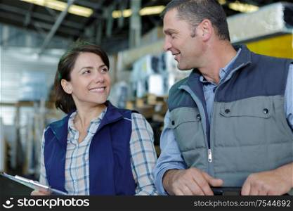 woman and man working in warehouse