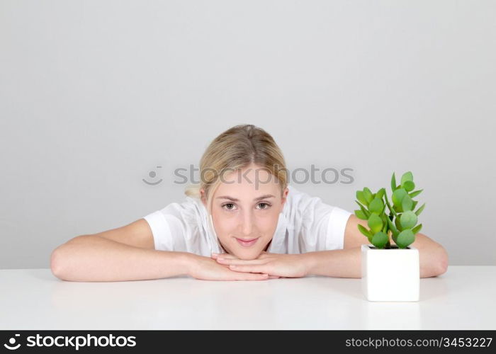 Woman and natural plants set on table