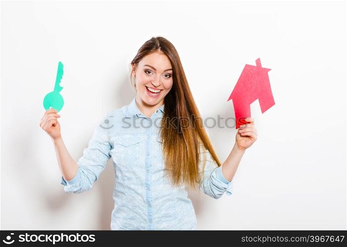 Woman and paper house. Housing real estate concept. Happy young woman girl holding red paper house and key dreaming about new home house. Housing and real estate concept.