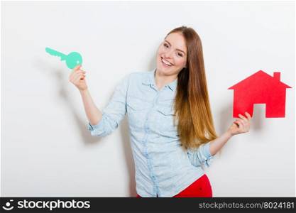Woman and paper house. Housing real estate concept. Happy young woman girl holding red paper house and key dreaming about new home house. Housing and real estate concept.