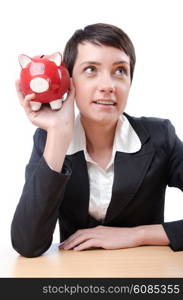 Woman and piggybank on white