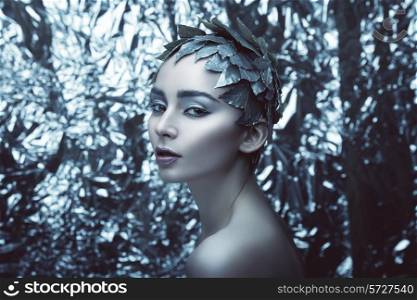 woman and silver leaves on head