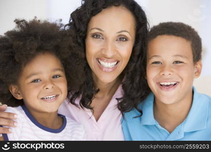 Woman and two young children smiling