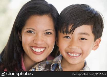 Woman and young boy smiling