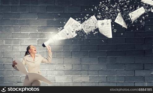 Woman announcing news. Portrait of young businesswoman with newspaper screaming in megaphone