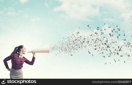 Woman announcing something. Young pretty woman screaming in paper trumpet