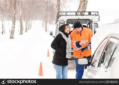 Woman answering inquiry broken car snow mechanic assistance road winter