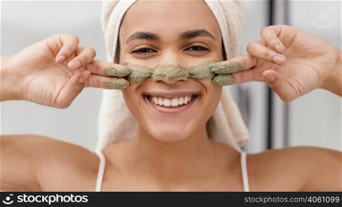 woman applying homemade treatment her face
